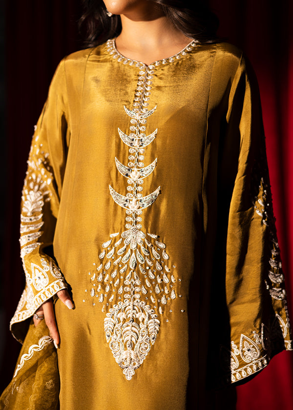 Olive green raw silk outfit with hand-done zardosi, Swarovski embellishments, and an embroidered organza dupatta.