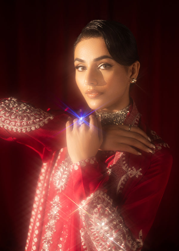 Buy Pink-Mavis raw silk kalidar dress online, featuring hand-embellished red & silver crystals, dabka work, scalloped hemline, embroidered chiffon dupatta, and tailored cigarette pants.