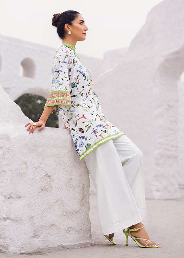 Whimsy Soft Mint Polka Dot & Floral Dress with Intricate Details by Zainab Musa.
