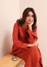 Carnelian rust raw silk suit with subtle pleats and a flowy silhouette